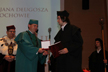 Dean of the Faculty of Mathematics and Natural Sciences of AJD, prof. Janusz Kapuśniak, is giving the Bene Merentibus Medal (photo by Marek Makowski)